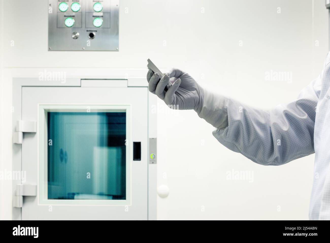 Scientist checks takes remote reading in biochemistry lab, Medicine production,Berlin,Germany Stock Photo