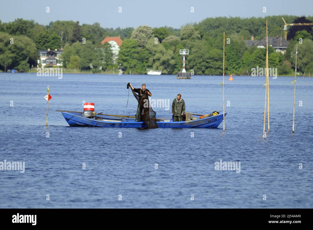 Fishermen controlling a weir on river Havel, Germany, Berlin Stock Photo