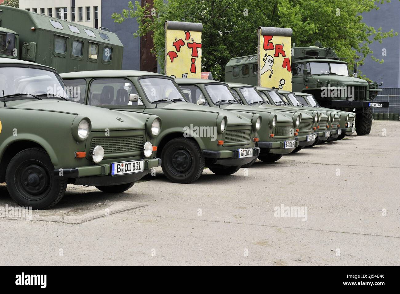 Old cars of the GDR type Trabant styled as army vehicles for city tours in Berlin, Germany, Berlin Stock Photo