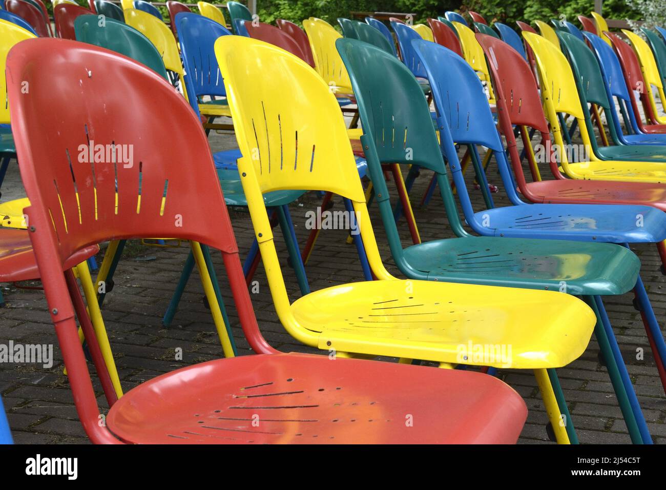 Spreepark, many colourful folding chaird in front of a stage at the former amusement park of the GDR, Germany, Berlin Stock Photo