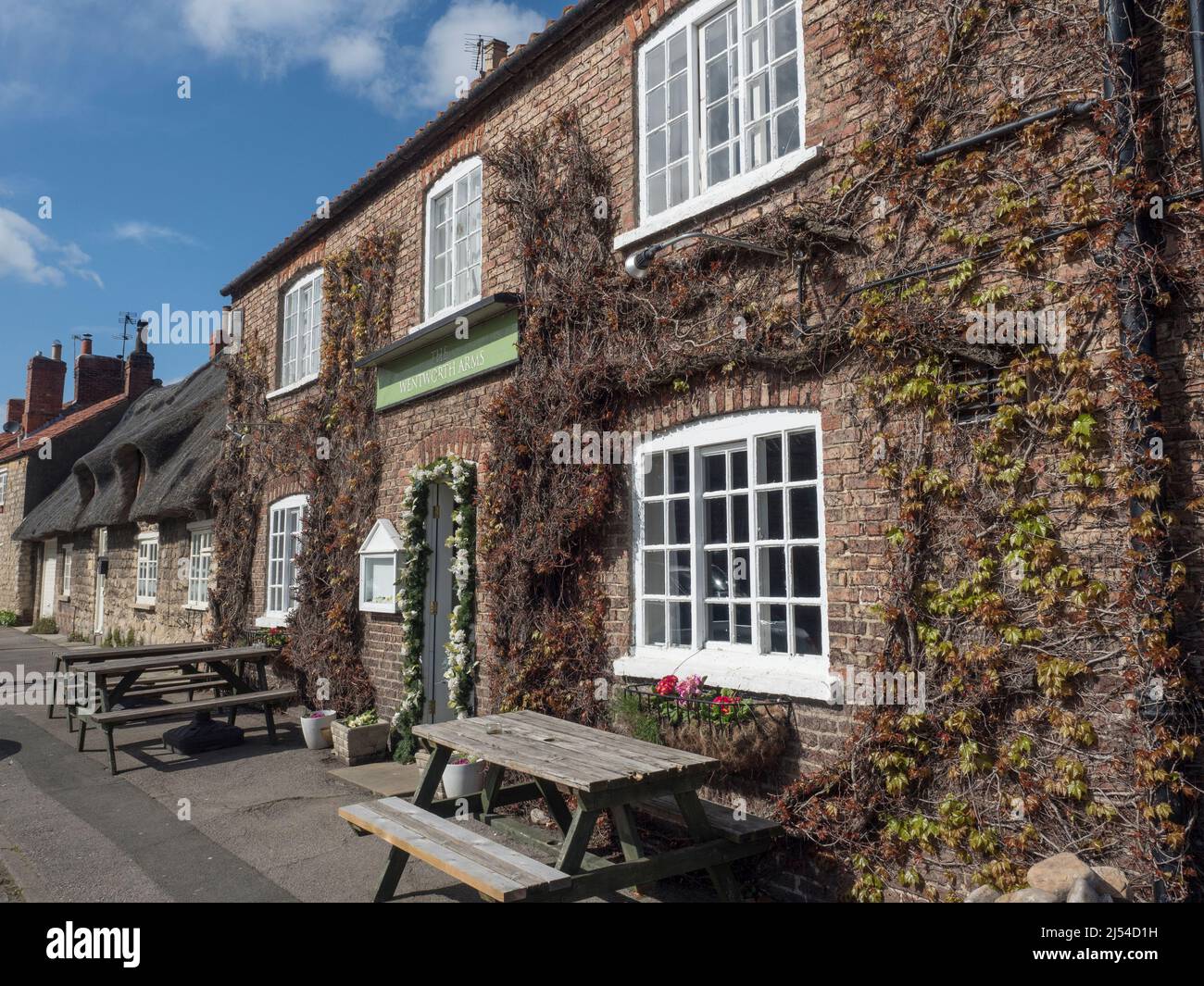The Wentworth Arms Hotel and Thatch Cottage listed buildings in Old Malton near Malton North Yorkshire England Stock Photo