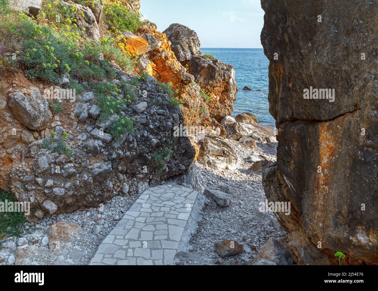 Path to the sea between the rocks . Coastal canyon Stock Photo