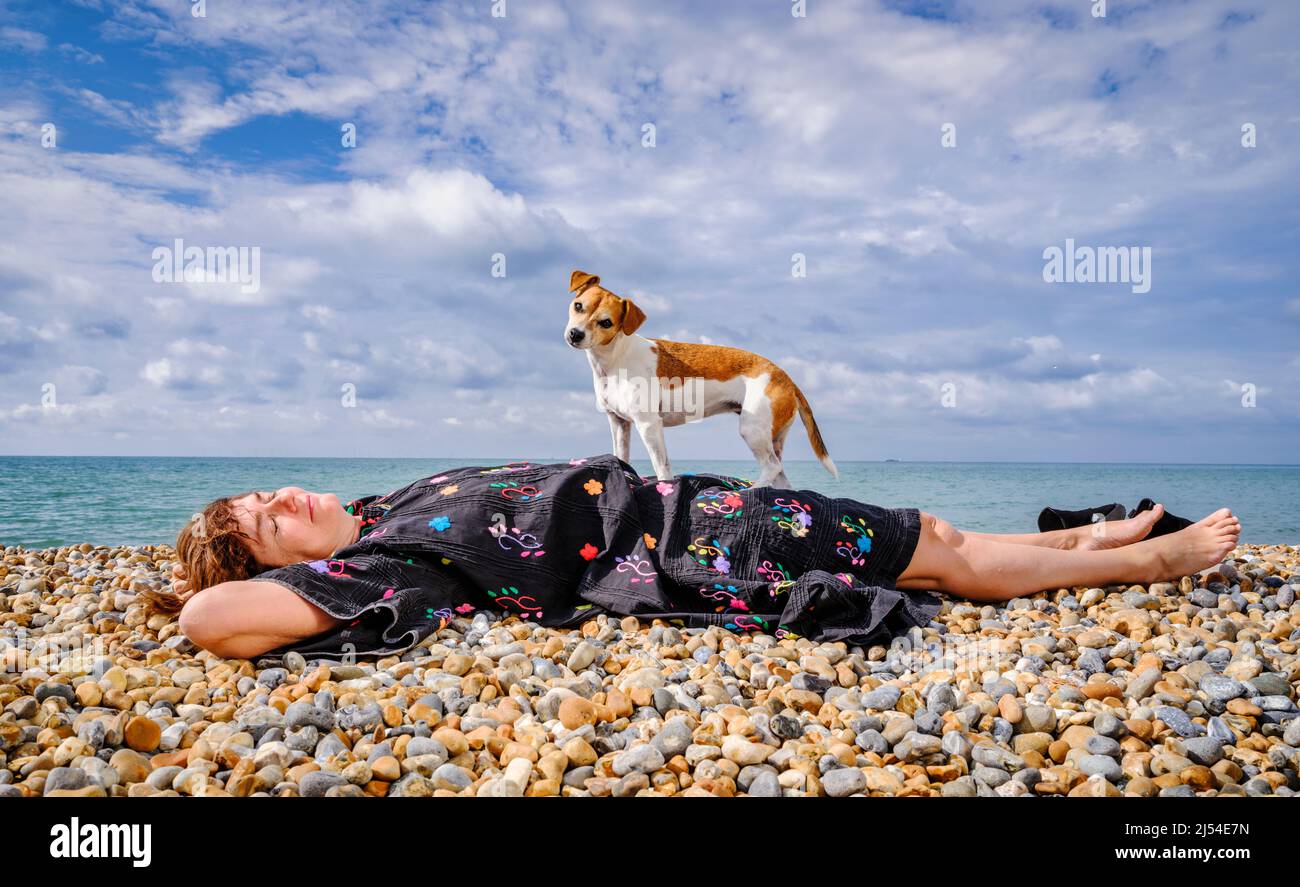 Editorial Use Only - Actress Anna Chancellor on Brighton beach with her dog, Fig. Picture by Jim Holden Stock Photo