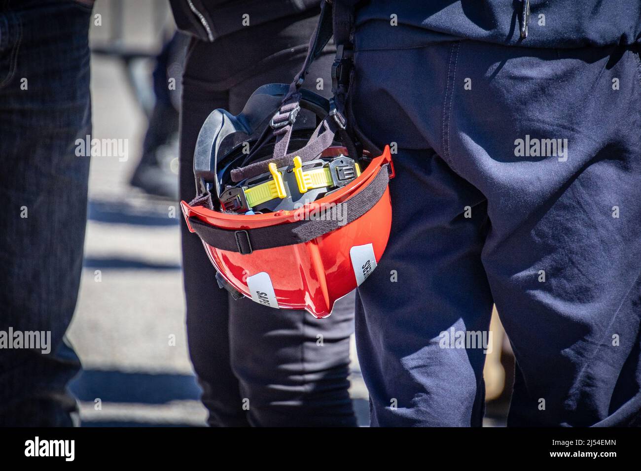 French firefighter helmet held by a person Stock Photo - Alamy