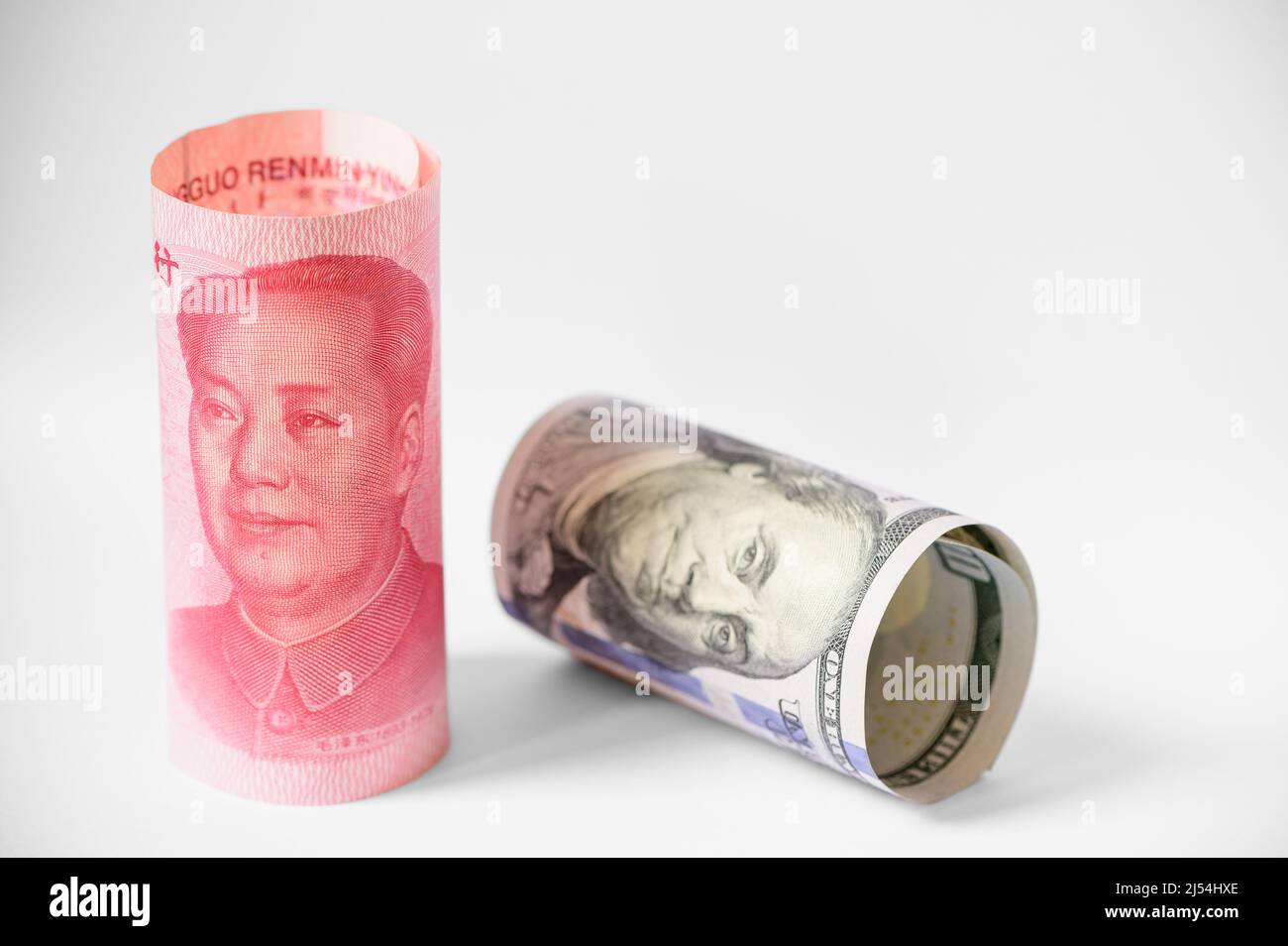 US dollar and Chinese yuan banknotes war Stock Photo