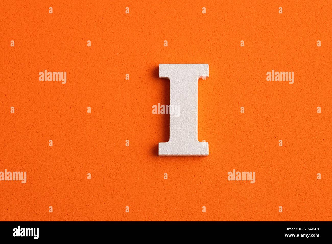 White wooden capital letter I on orange foamy background Stock Photo ...