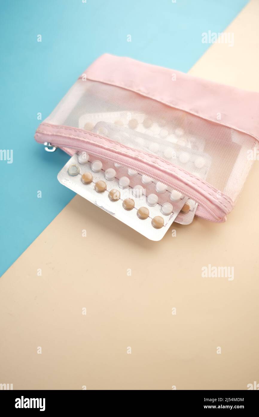 birth control pills on wooden background, close up  Stock Photo