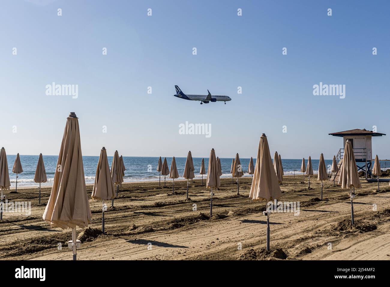 Larnaca, Cyprus. 20th Apr, 2022. A Aegean airlines plane is landing at Larnaca International airport as seen from Mackenzie Beach, Larnaca, Cyprus, on Apr. 20, 2022. The government of Cyprus is considering approaching new tourist markets in order to cover the gap left in the tourist industry by the situation in Ukraine. The Russian and Ukrainian tourists form up to 25% of the Cypriot tourist market. (Photo by Kostas Pikoulas/Sipa USA). Credit: Sipa USA/Alamy Live News Stock Photo