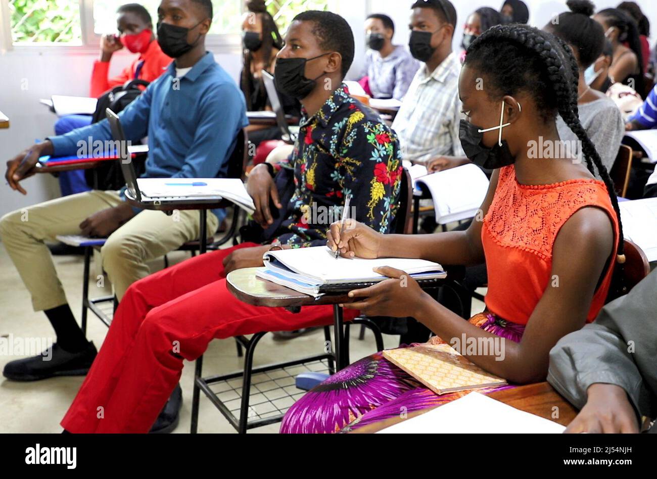 (220420) -- KAMPALA, April 20, 2022 (Xinhua) -- Students pursuing a bachelor's degree in Chinese and Asian studies attend a Chinese language class at the Confucius Institute in Makerere University in Kampala, Uganda, April 12, 2022. As the world commemorates the annual United Nations (UN) Chinese Language Day on Wednesday, Ugandan youths are gearing up to learn Chinese. They see the language used in the second largest economy as a tool with which they can access a broader future.TO GO WITH 'Feature: Ugandan youths eye career opportunities through Chinese language learning' (Xinhua/Zhang Gaipin Stock Photo