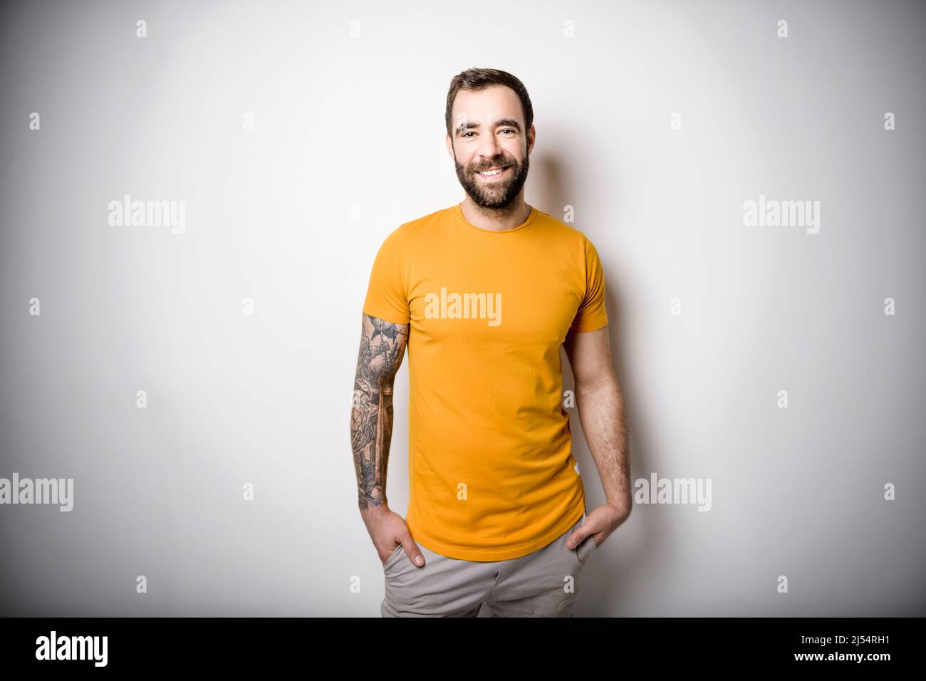 Person in orange shirt hi-res stock photography and images - Alamy