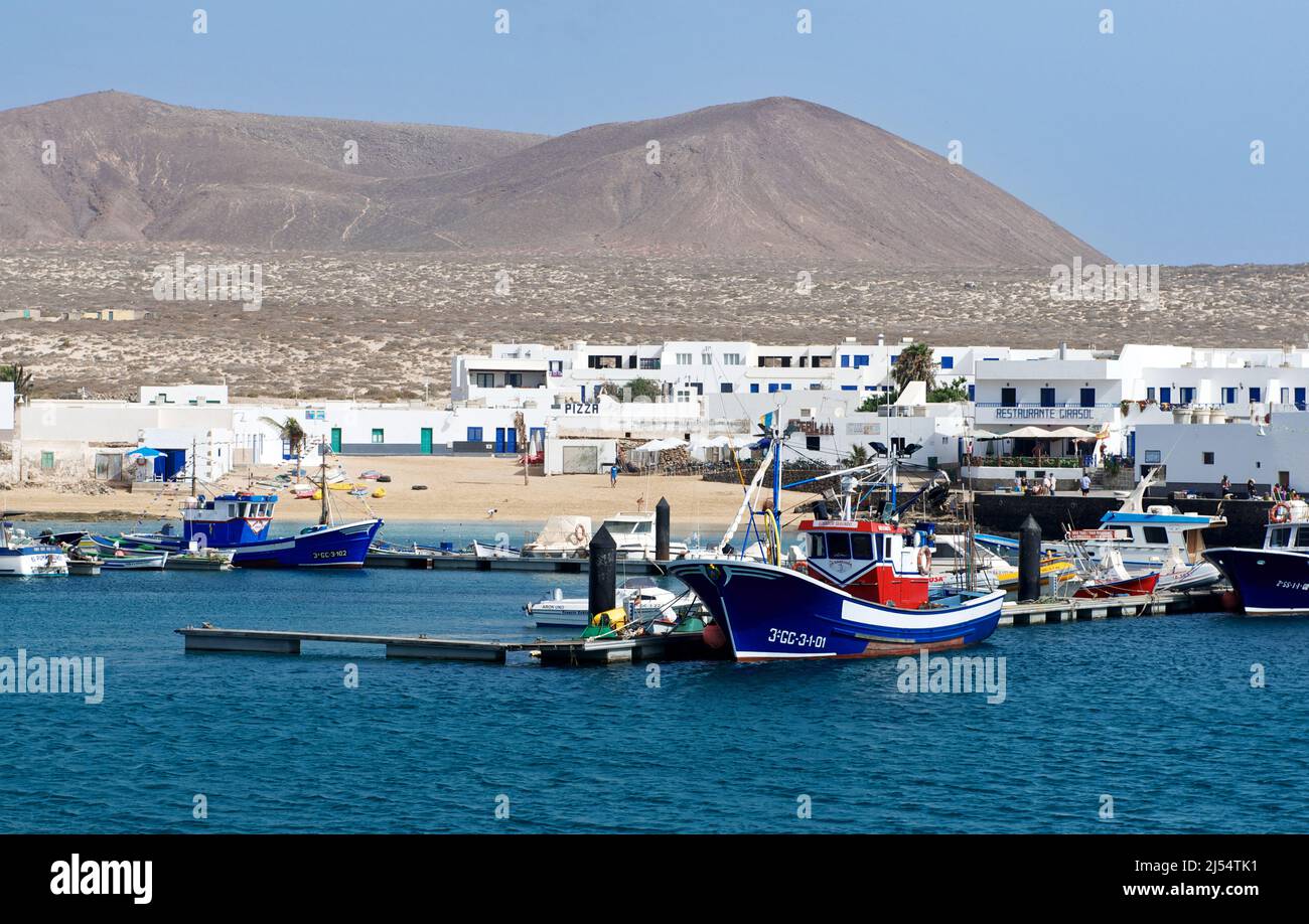 Caleta de Sebo, La Graciosa, Spain – Apr 16, 2019: Panorama of Caleta de Sebo Port on La Graciosa Island, Canary Islands, from the Ocean. Stock Photo