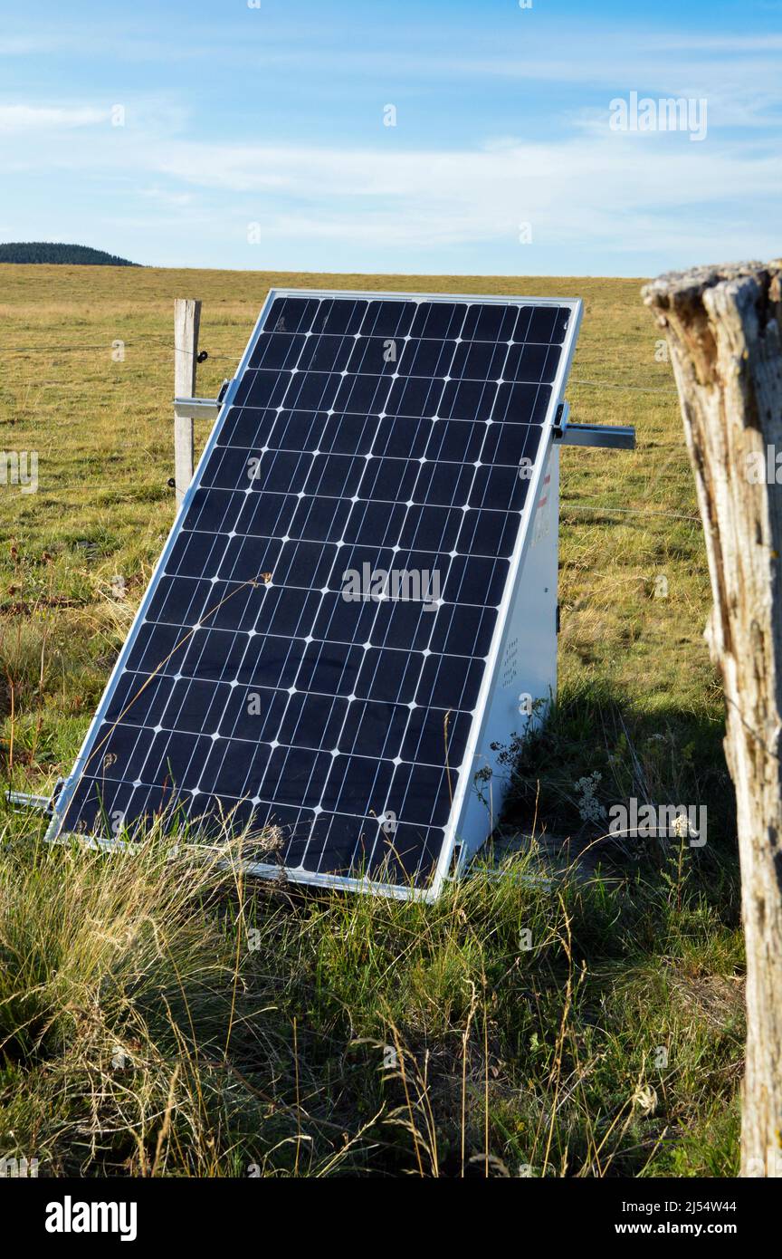Solar fence system with photovoltaic panels to power an electric fence. Stock Photo