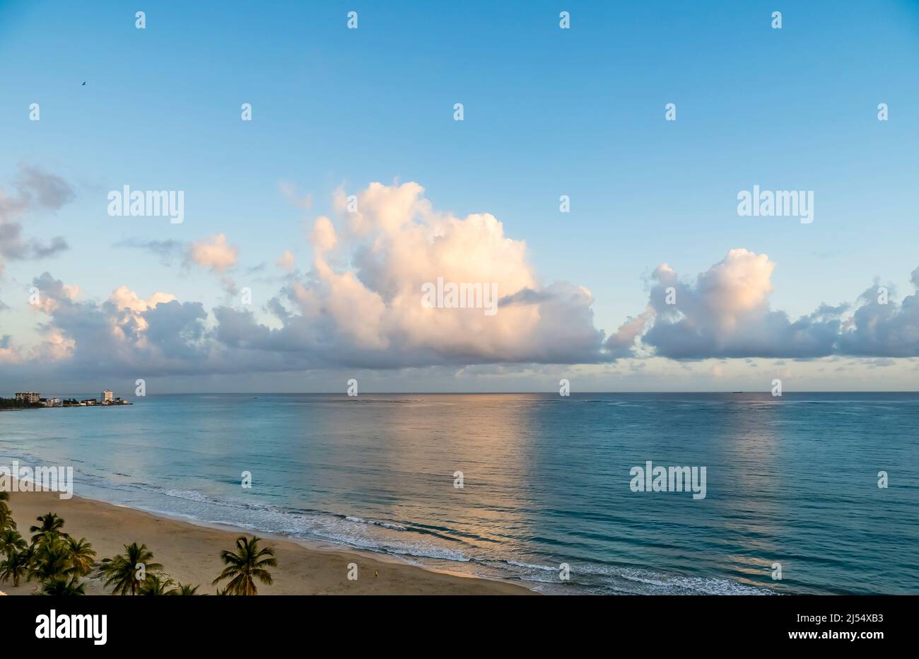 Early morning clouds over sla Verde  Beach on the Atlantic Ocean in the Metropolitan Area of San Juan in Carolina Puerto Rico, Stock Photo