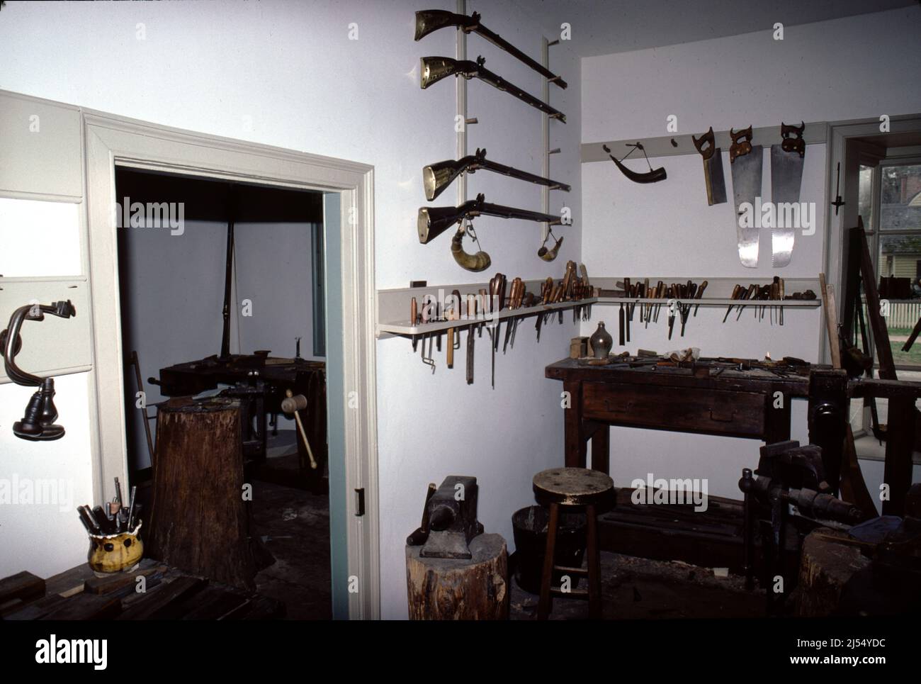 Williamsburg, VA. U.S.A. 9/1987. Master gunsmith for Colonial 18th Century rifles, pistols and fowling shotguns.  Using 18th century gunsmithing tools craft each firearm from wood stock to lock. Stock Photo