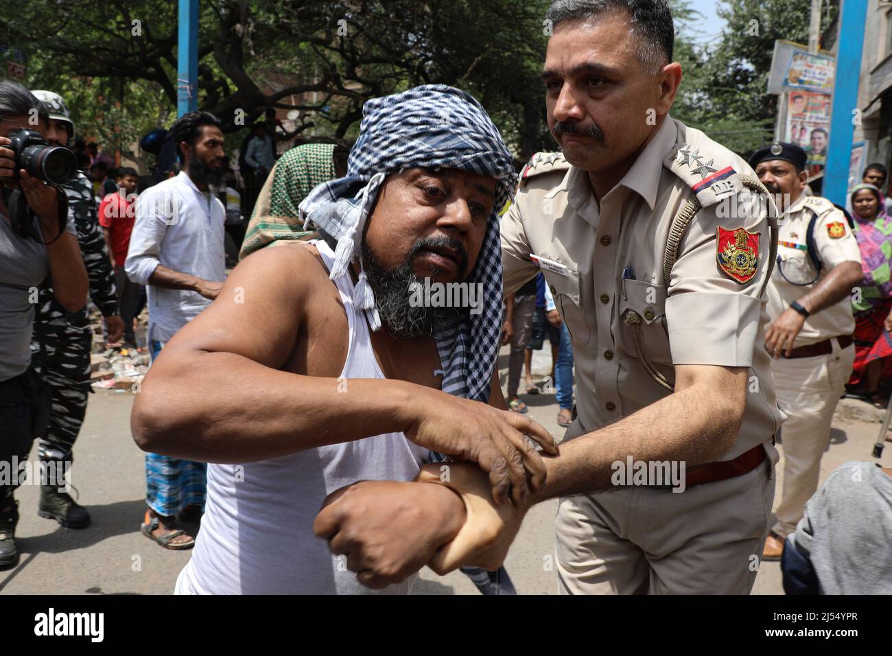 New Delhi, New Delhi, India. 20th Apr, 2022. A police officer detains a Muslim resident in a communally sensitive area in Jahangirpuri. (Credit Image: © Karma Sonam Bhutia/ZUMA Press Wire) Stock Photo