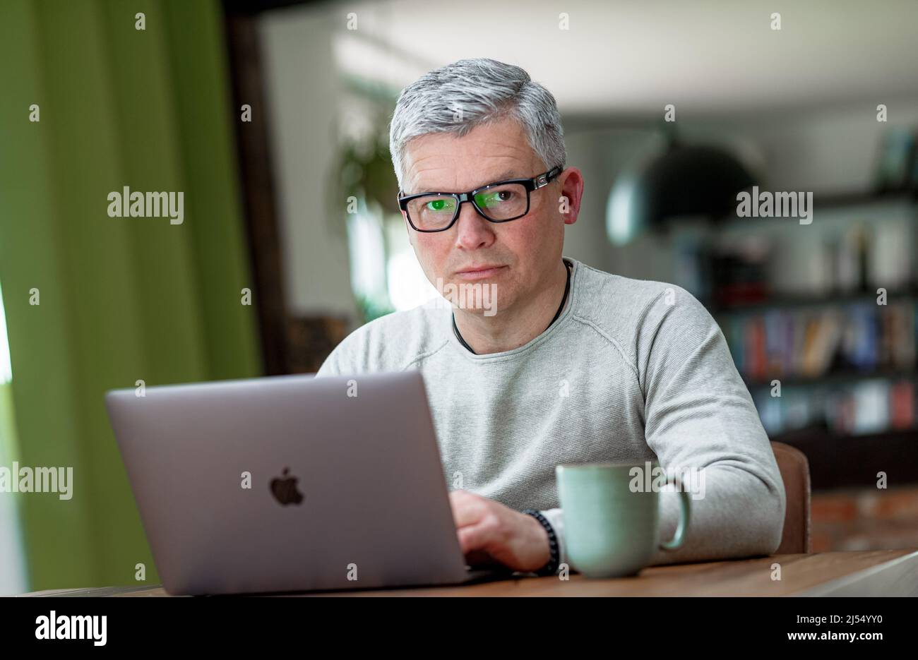 Hyerhagen, Germany. 08th Apr, 2022. Bestselling author Andreas Winkelmann writes his texts only on his laptop. Credit: Markus Scholz/dpa/Alamy Live News Stock Photo
