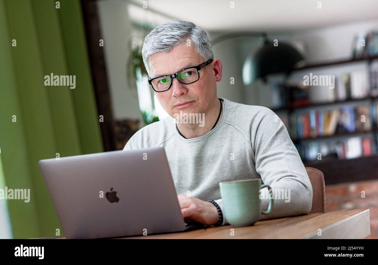 Hyerhagen, Germany. 08th Apr, 2022. Bestselling author Andreas Winkelmann writes his texts only on his laptop. Credit: Markus Scholz/dpa/Alamy Live News Stock Photo