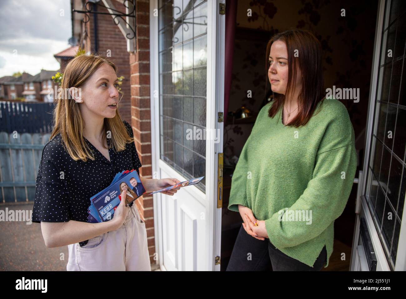 Lauren Kerr (left), UUP Belfast East candidate in upcoming the 2022 Northern Ireland Assembly election speaking with Rachel Lemon while canvassing in east Belfast. Stock Photo