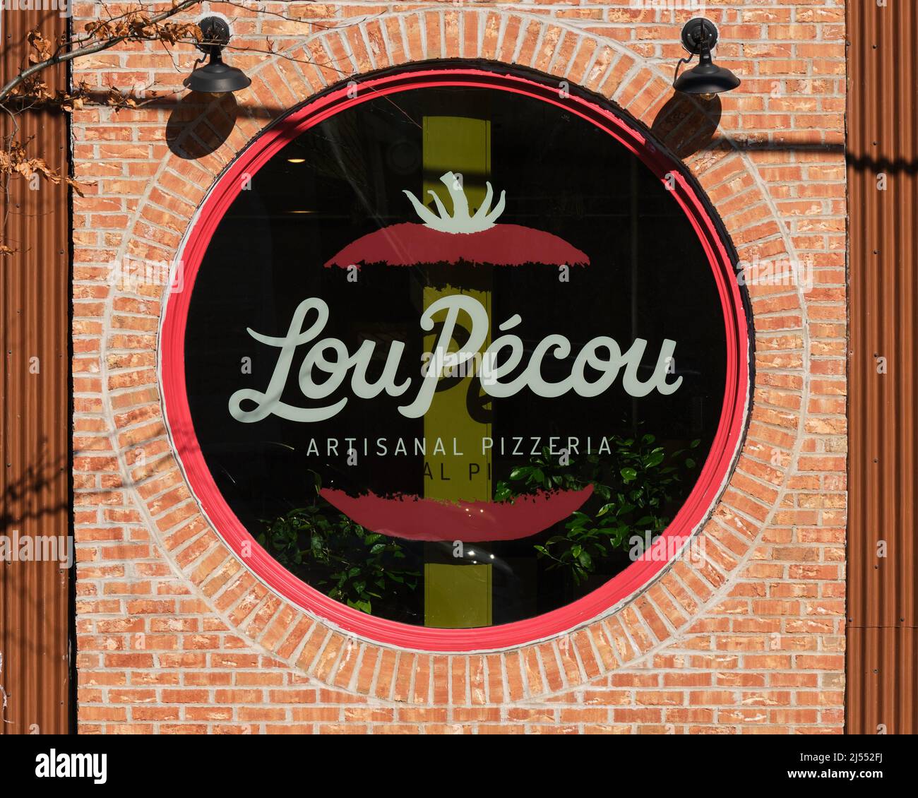 Street façade sign of Lou Pecou artisanal pizzeria in Halifax Nova Scotia Stock Photo