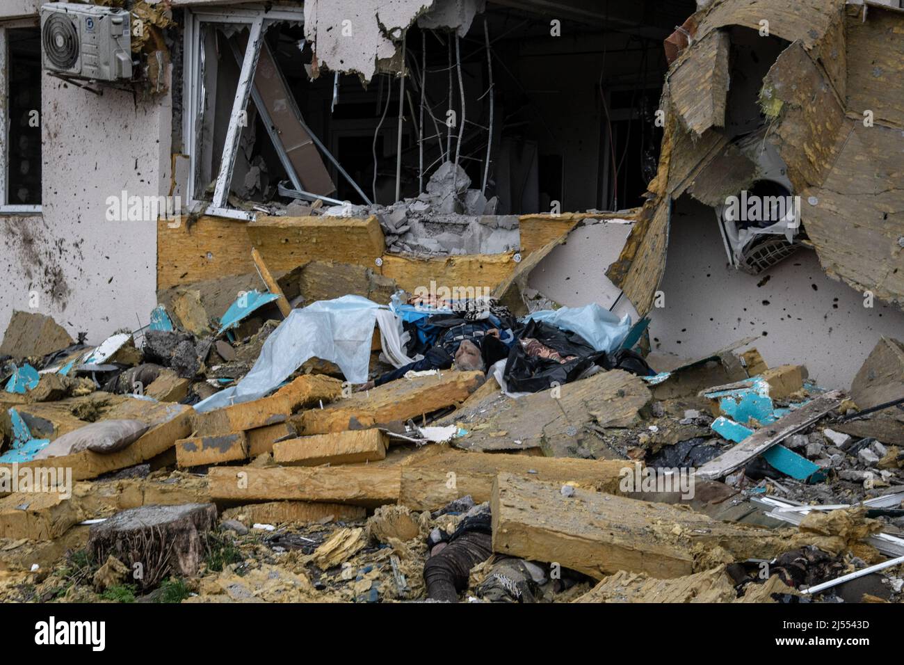 Mariupol, Ukraine. 14th Apr, 2022. (Editors note image depicts death) Multiple bodies killed by shelling lie amidst rubble in a hospital facing the Azovstal plant in Mariupol, one of the last remaining strongholds of the Ukrainian defense. The battle between Russian/Pro Russian forces and the defending Ukrainian forces led by the Azov battalion continues in the port city of Mariupol. Credit: SOPA Images Limited/Alamy Live News Stock Photo