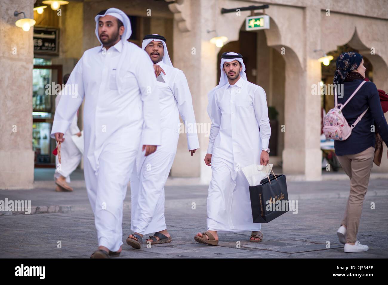 Doha,Qatar - April 15,2022 : Qatari locals in traditional attire hang ...