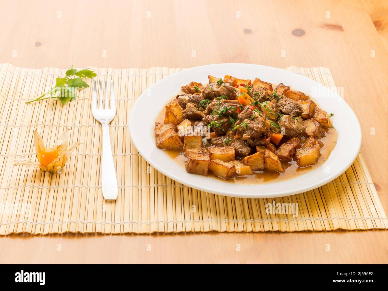 Typical Spanish food, meat stew with potatoes. Stock Photo