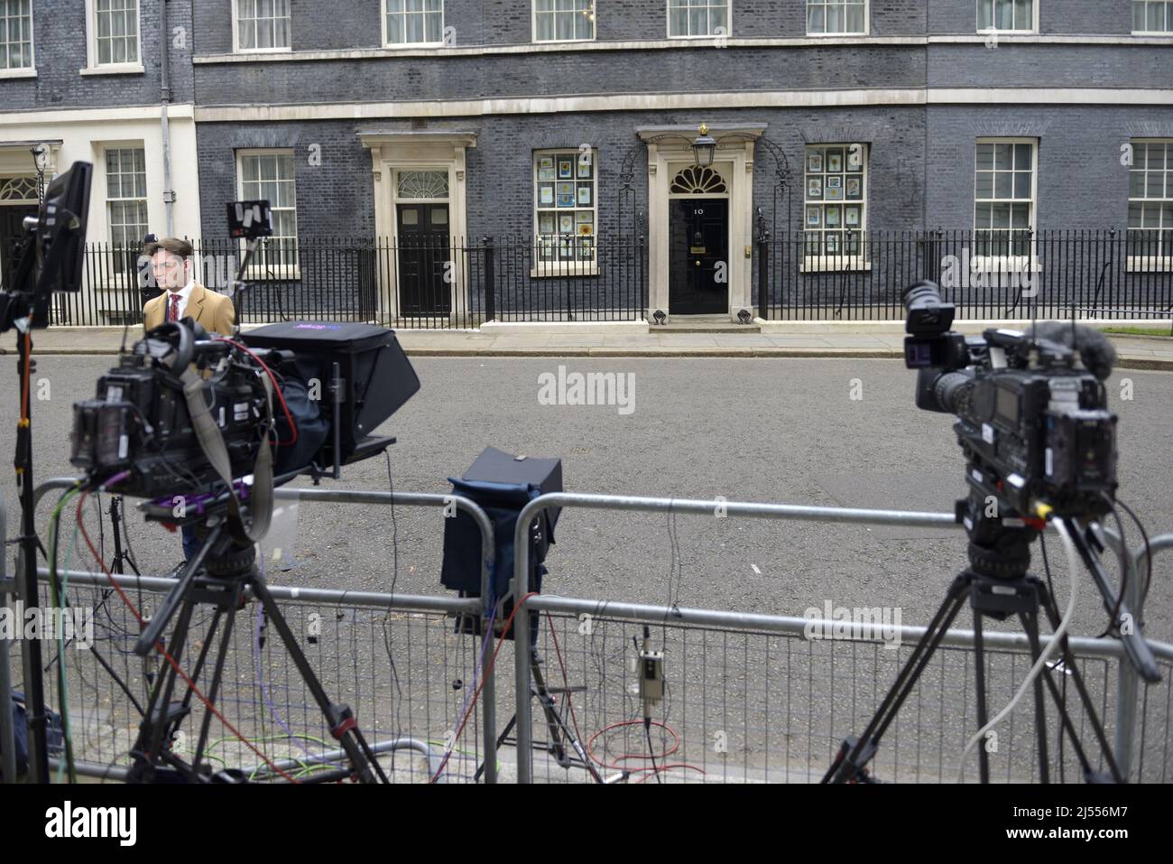 London, England, UK. TV cameras in Downing Street, focussed on the door of Number 10. GB News's Tom Harwood (left) Stock Photo