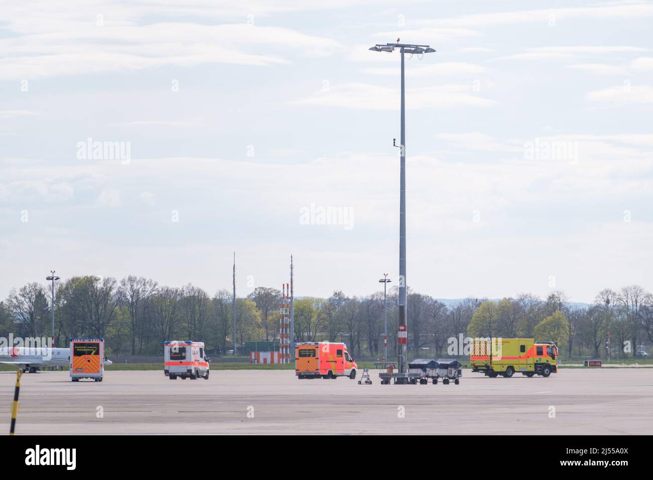 Langenhagen, Germany. 20th Apr, 2022. Ambulances wait on the tarmac at Hannover Airport for the arrival of a German Air Force A310 MedEvac. The special A310 MedEvac aircraft is to bring injured Ukrainian civilians to Germany for medical treatment. The A310 MedEvac is the air force's flying intensive care unit. After landing, further treatment takes place in civilian hospitals. Credit: Ole Spata/dpa/Alamy Live News Stock Photo