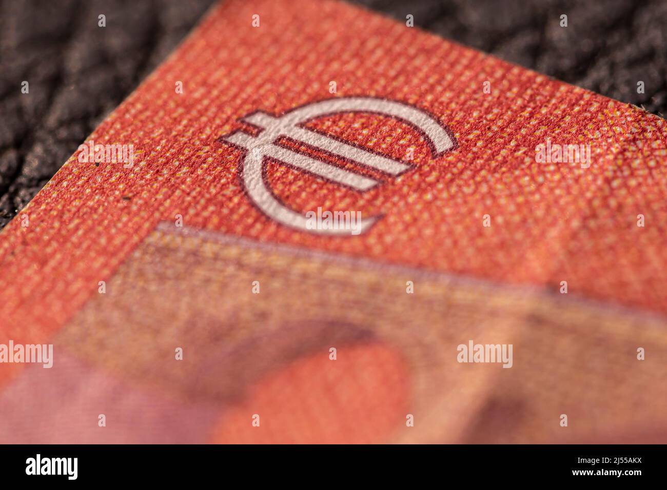 Close-up shot of Euro sign and text present on a banknote Stock Photo ...