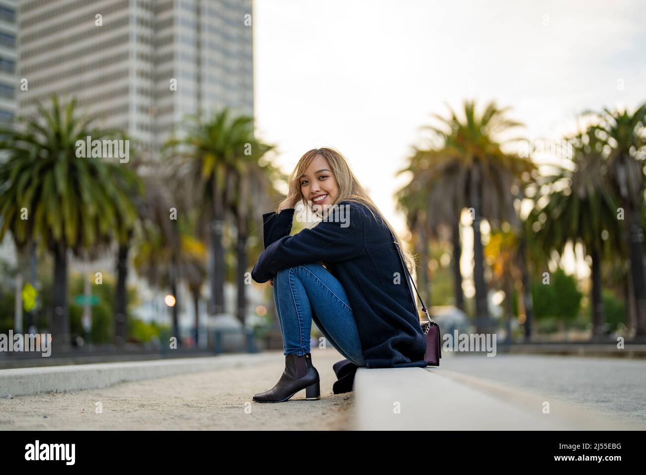 Young Woman in Casual Fall Wardrobe on Outdoor Bocce Ball Court in San