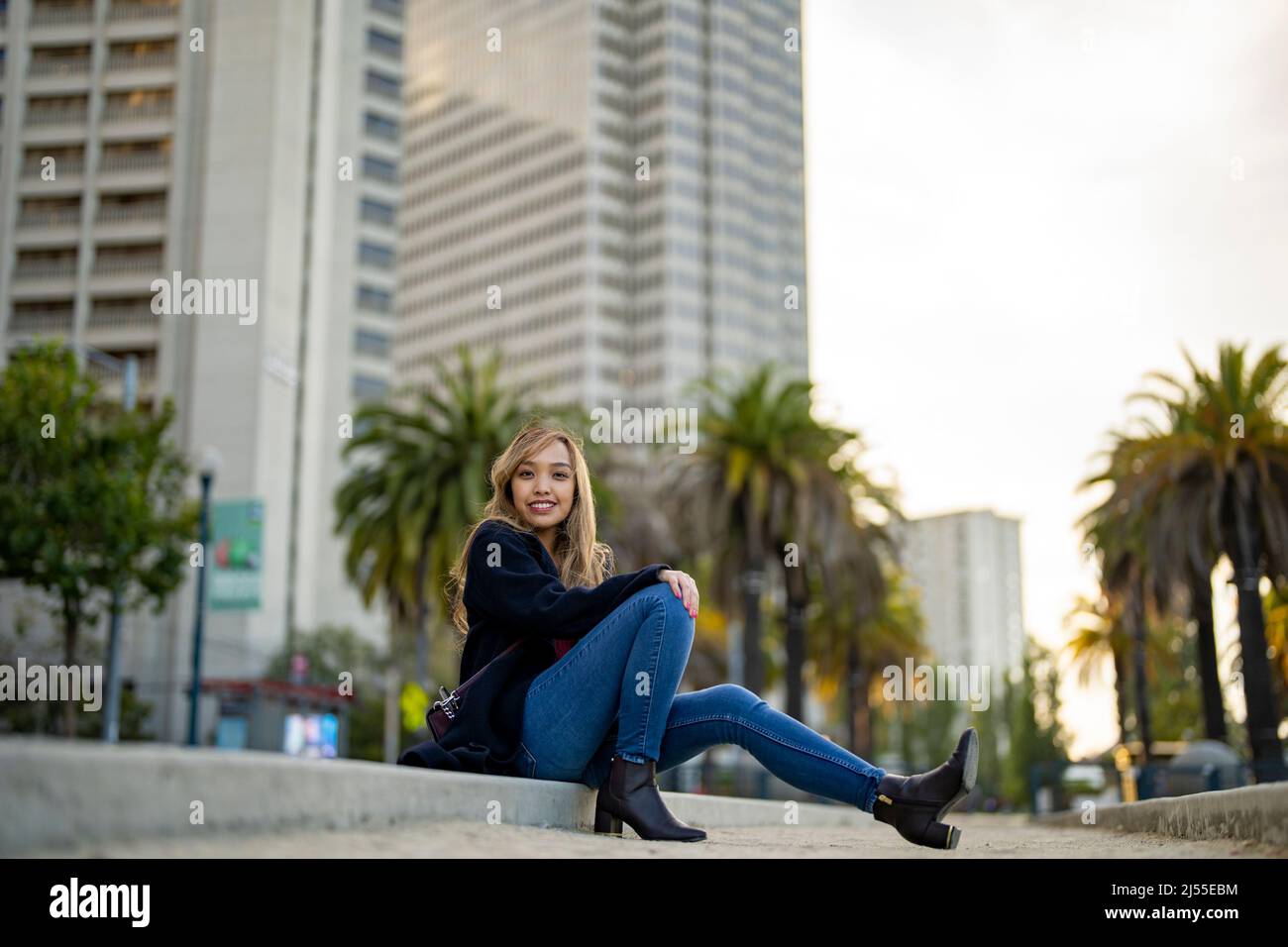 Young Woman in Casual Fall Wardrobe on Outdoor Bocce Ball Court in San