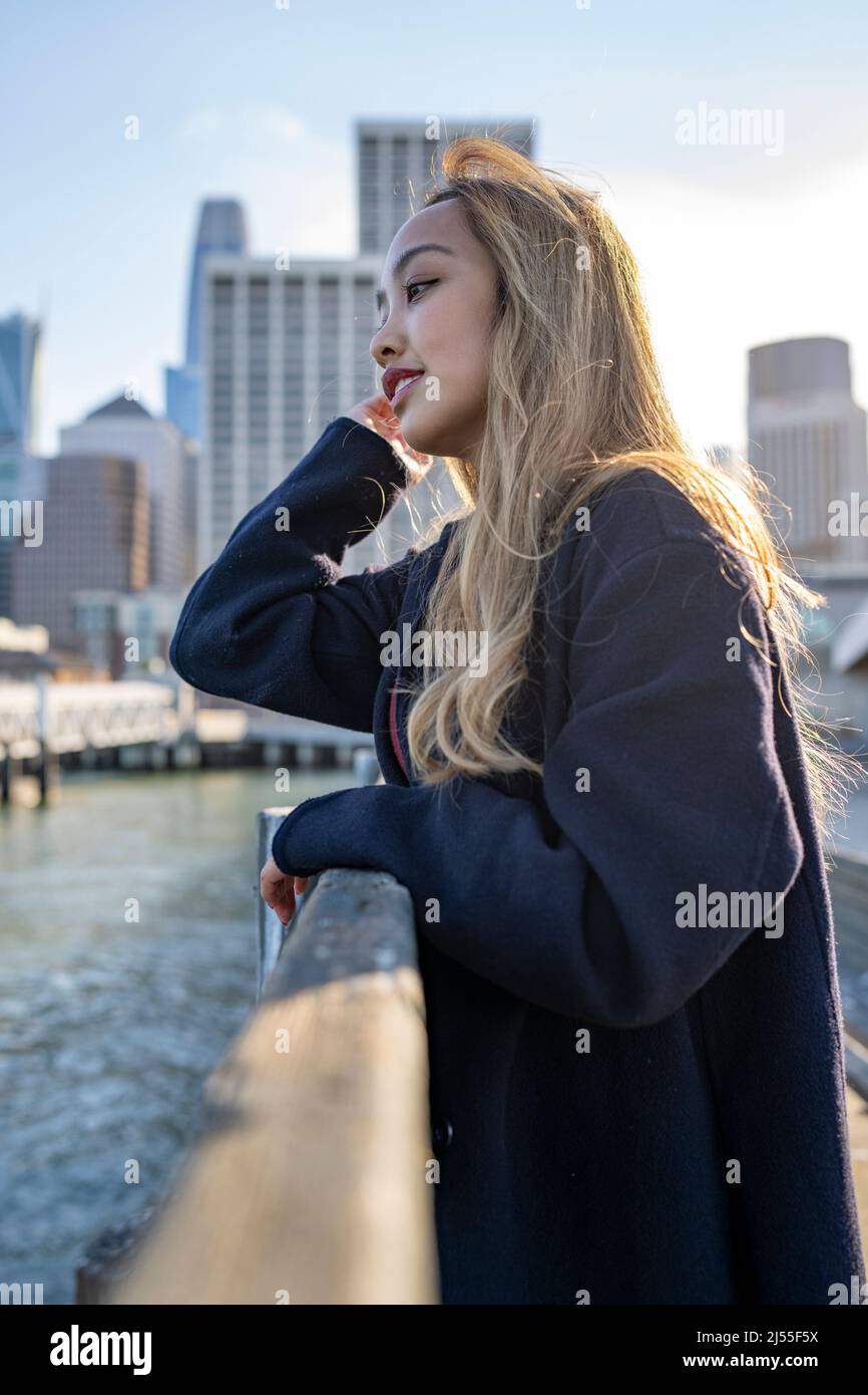 Beautiful Happy Young Woman Looking Out on a San Francisco Marina | Lifestyle Local Tourism Stock Photo