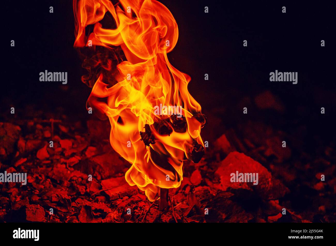 High pillar of fire coming out of stone. Red fire burning flame Stock Photo Alamy