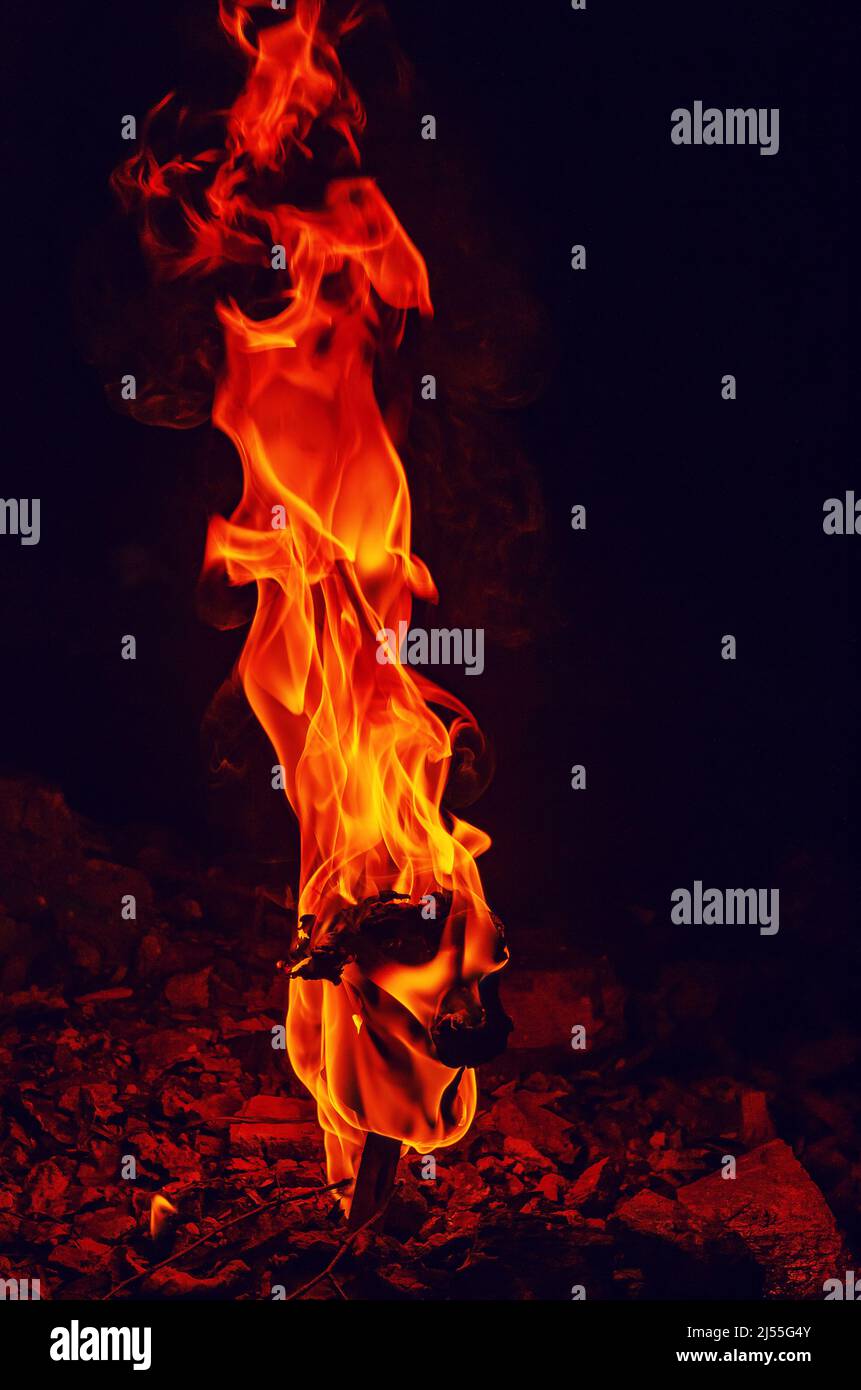 High pillar of fire coming out of stone. Red fire burning flame Stock