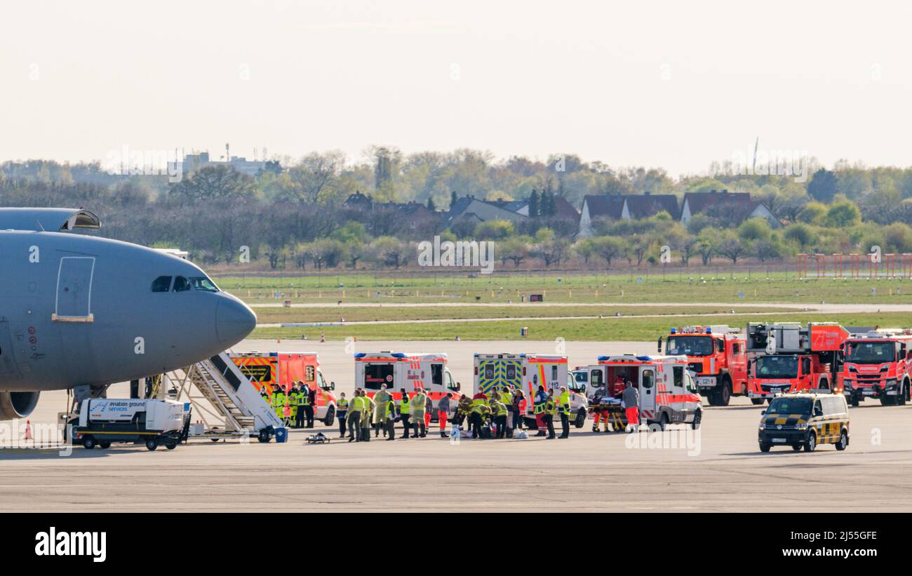 Langenhagen, Germany. 20th Apr, 2022. A German Air Force A310 MedEvac stands next to ambulances on the tarmac at Hannover Airport. The special A310 MedEvac aircraft is to bring injured Ukrainian civilians to Germany for medical treatment. The A310 MedEvac is the air force's flying intensive care unit. After landing, further treatment will take place in civilian hospitals. Credit: Ole Spata/dpa/Alamy Live News Stock Photo