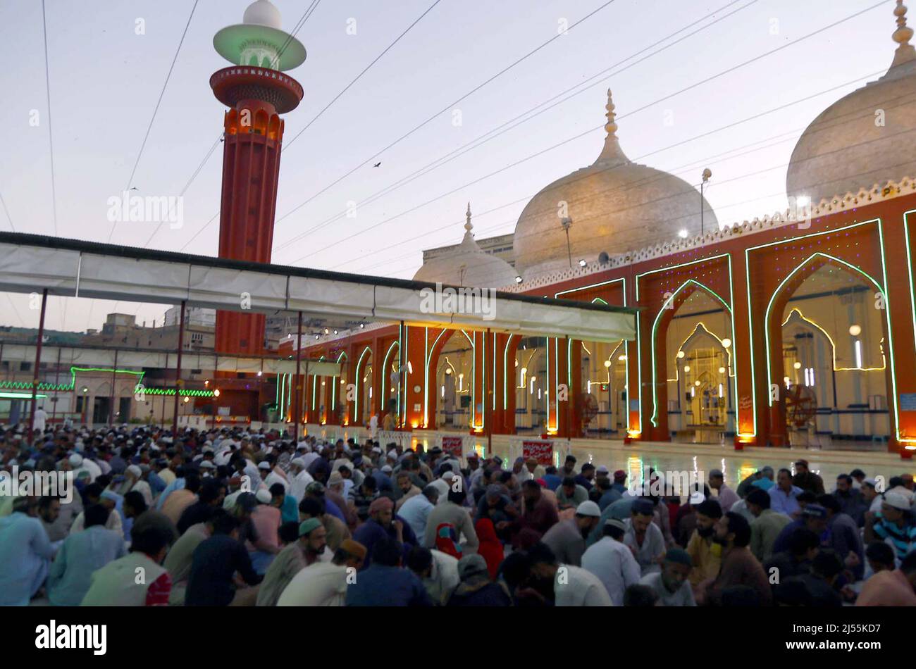 Faithful Muslims sit for Iftar (breaking fast meal), during the Holy ...