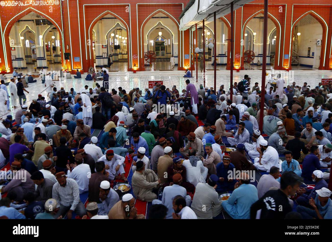 Faithful Muslims sit for Iftar (breaking fast meal), during the Holy ...