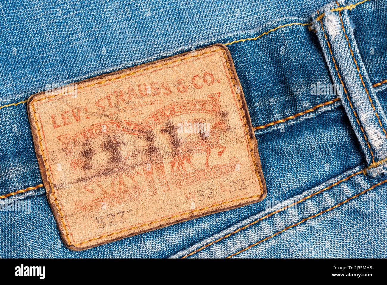 Levi's weathered back emblem on classic 527 boot cut blue jeans Stock Photo