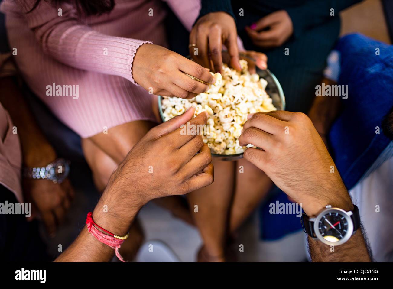 four arabian friends watching funny movie at home Stock Photo