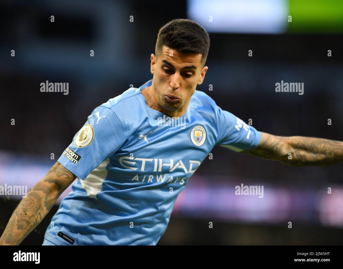 City Stadium, Manchester, UK. 20th Apr, 2022. Premier League football, Manchester City versus Brighton and Hove Albion; Joao Cancelo of Manchester City concentrates on the ball Credit: Action Plus Sports/Alamy Live News Stock Photo