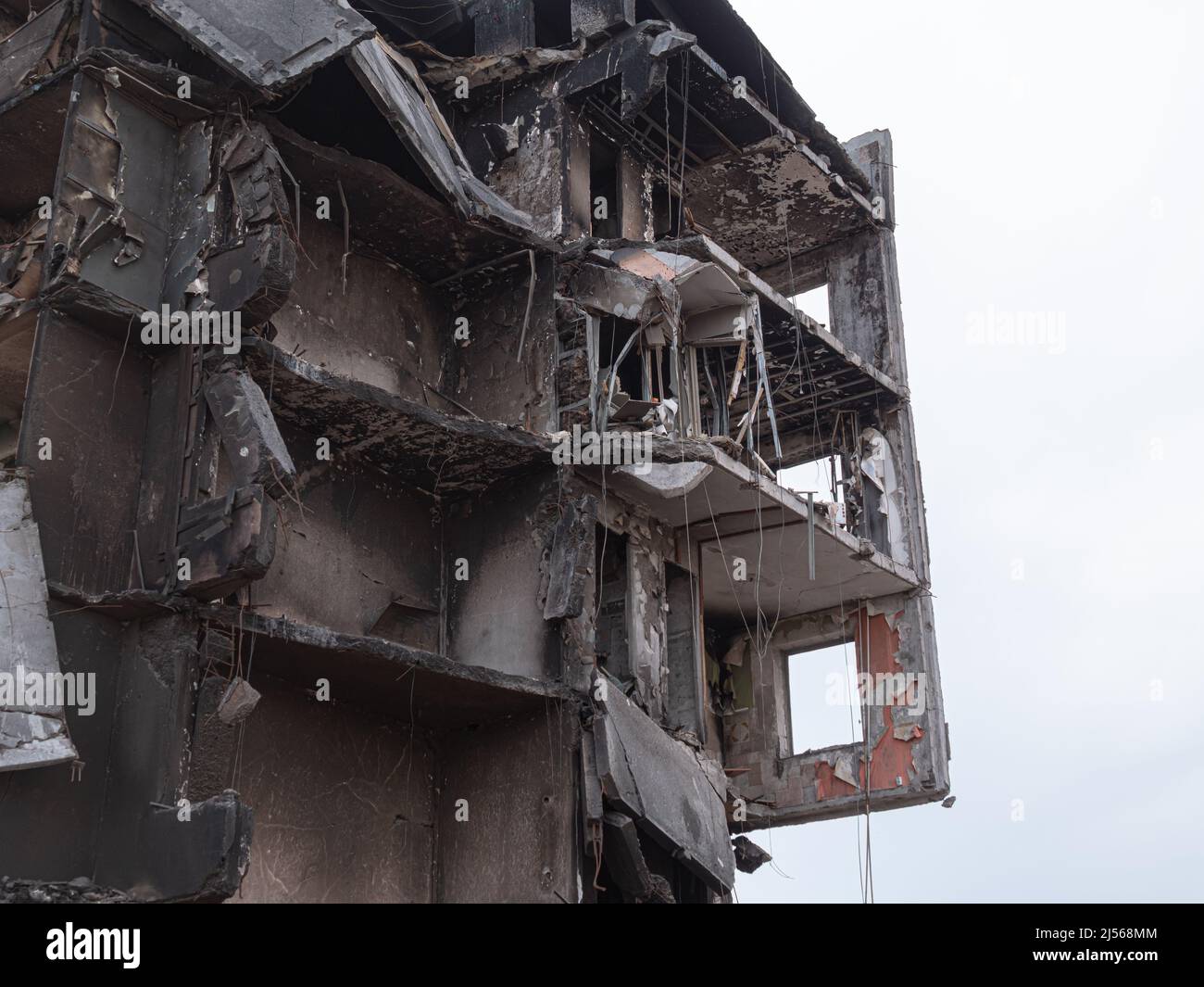 Destroyed buildings after the bombing, closeup. Russian invasion of
