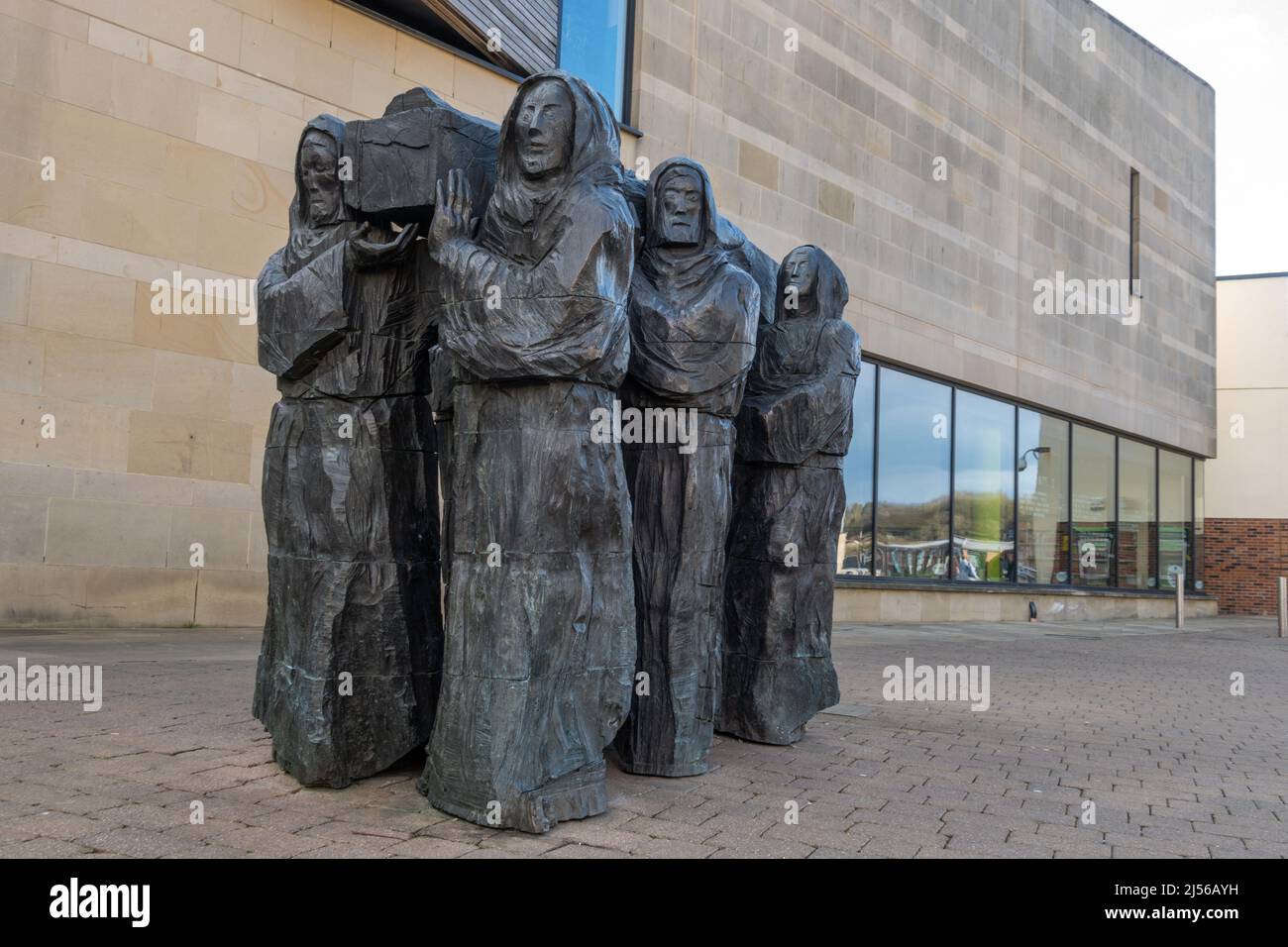 The Journey sculpture by Fenwick Lawson, monks carrying the coffin of St Cuthbert, in Millennium Place in Durham, Uk Stock Photo