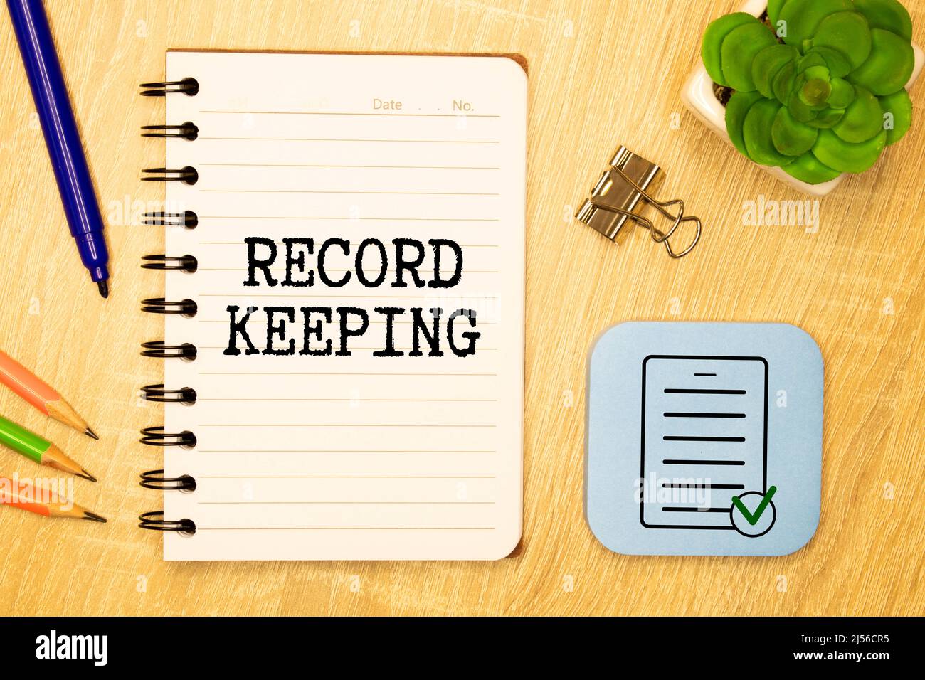 Record keeping text written on a notebook with pencils. Stock Photo