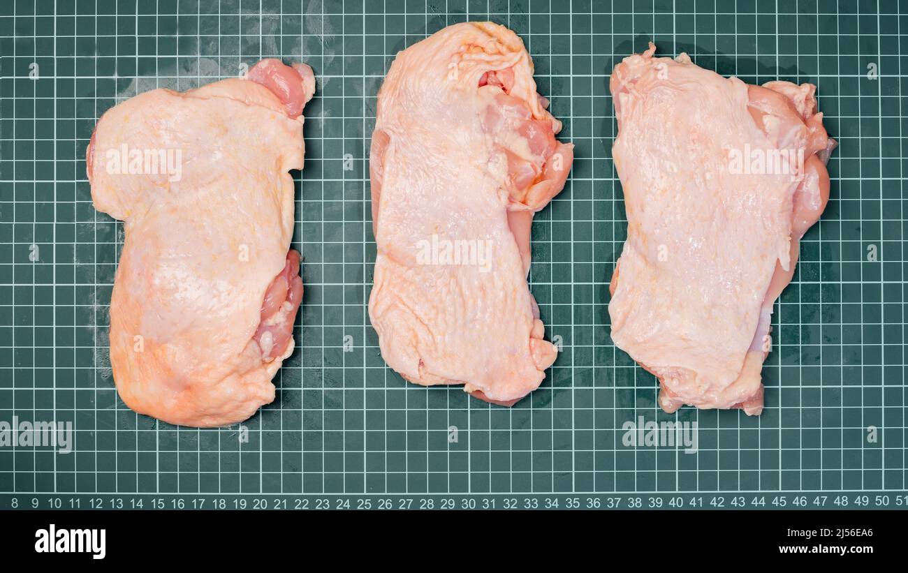 https://c8.alamy.com/comp/2J56EA6/raw-chicken-thigh-with-skin-boneless-for-cooking-on-wooden-cutting-boardchicken-thigh-meat-on-a-linear-board-2J56EA6.jpg