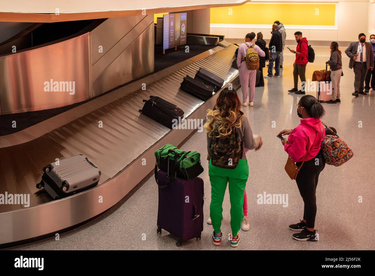 Los Angeles, CA April 20th Customers wait for their luggage at the new