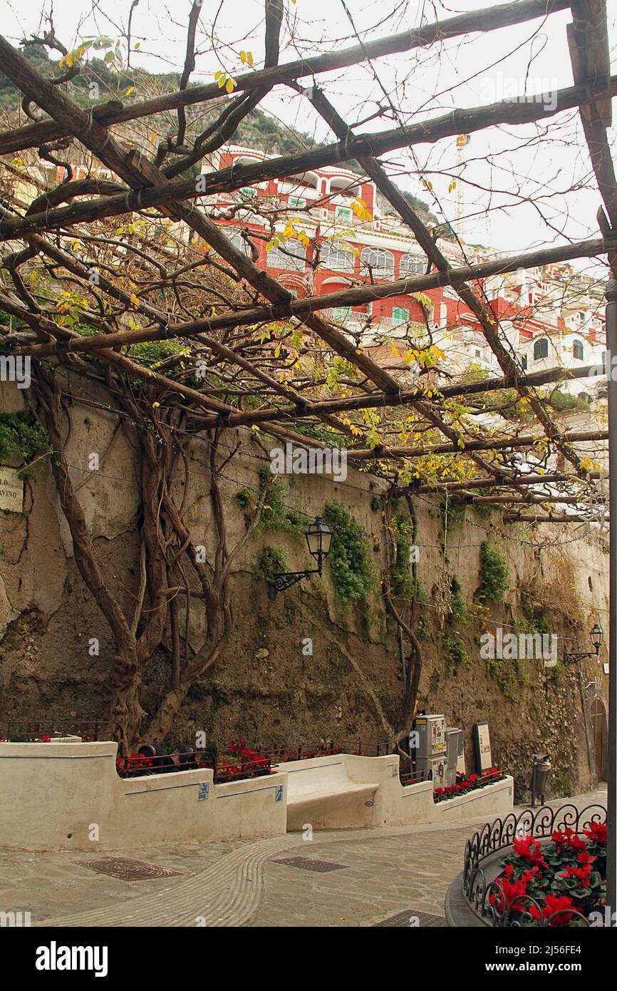 Wooden support for a green canopy over an alleyway in Positano, Italy Stock Photo