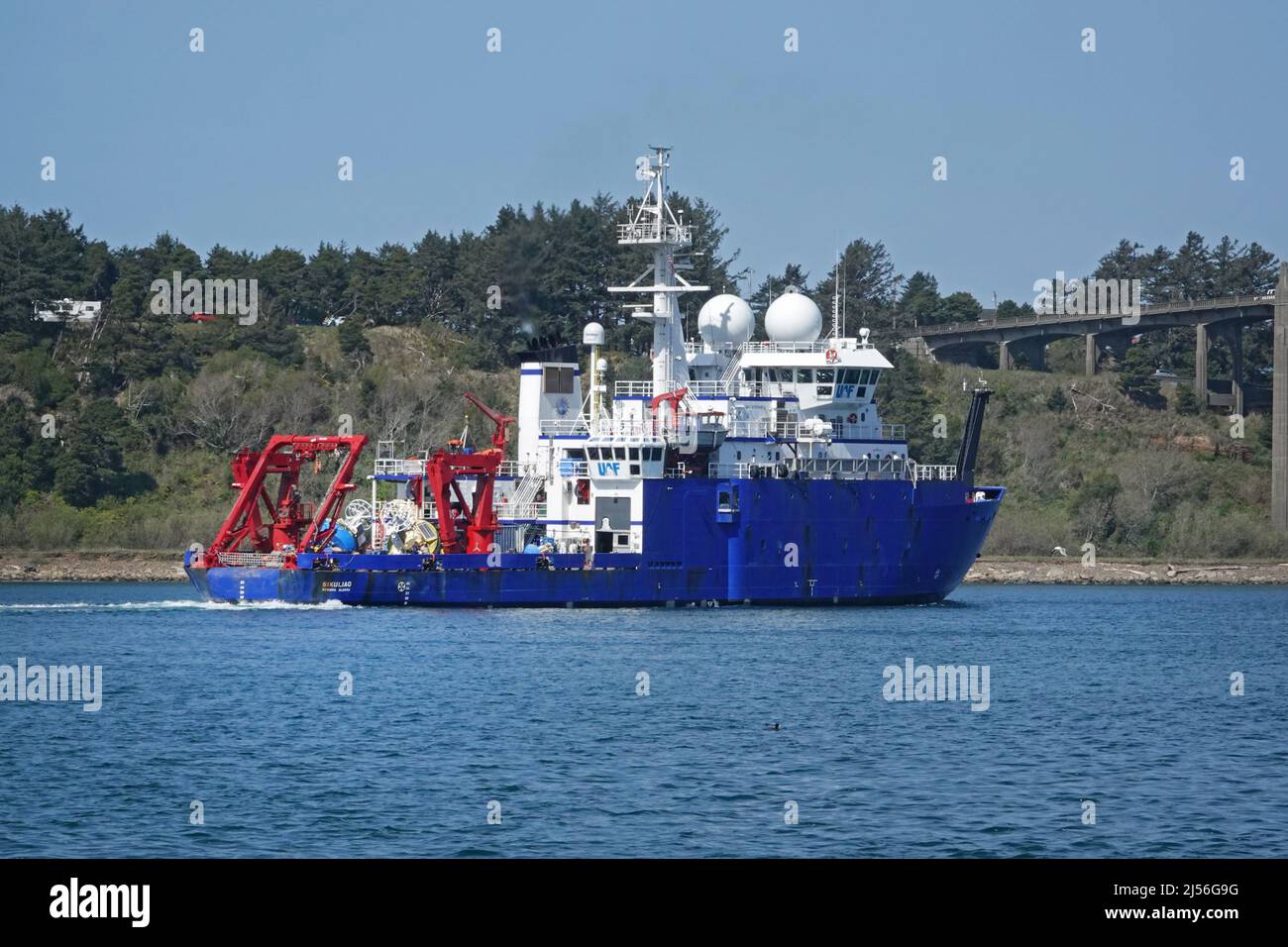 The R/V Sikuliaq, a National Science Foundation research vessel and ice breaker stationed in Alaska, entering the harbor at Newport, Oregon. Stock Photo