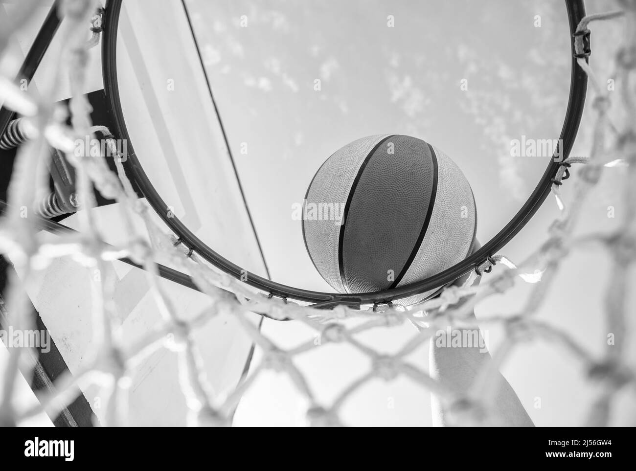 dunking in basket. slam dunk in motion. professional player. sport