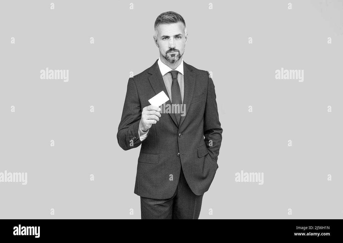 businessman demonstrating credit or debit card. empty plastic business name card. Stock Photo