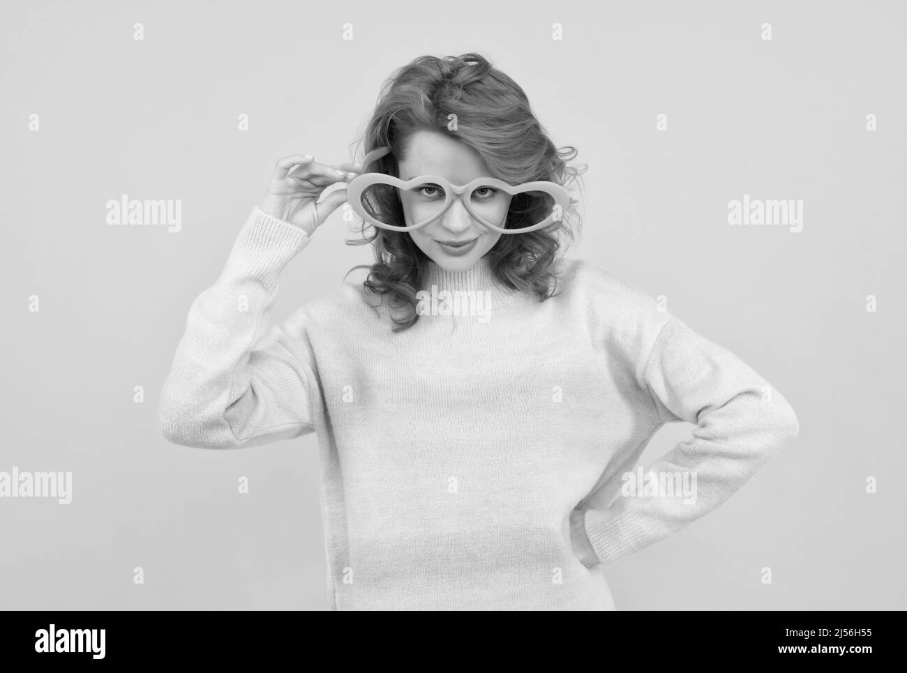 feeling flirty. funny girl wear big glasses. birthday party. express positivity. positive emotions. Stock Photo